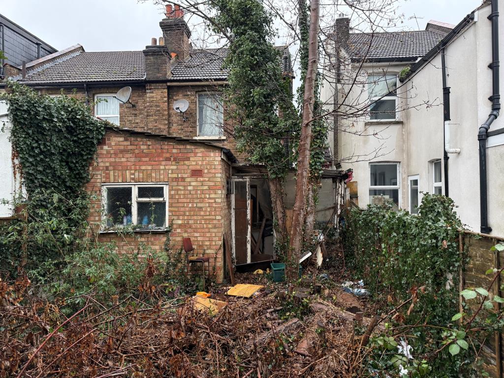 Lot: 168 - HOUSE IN NEED OF REFURBISHMENT - View of rear of house from garden